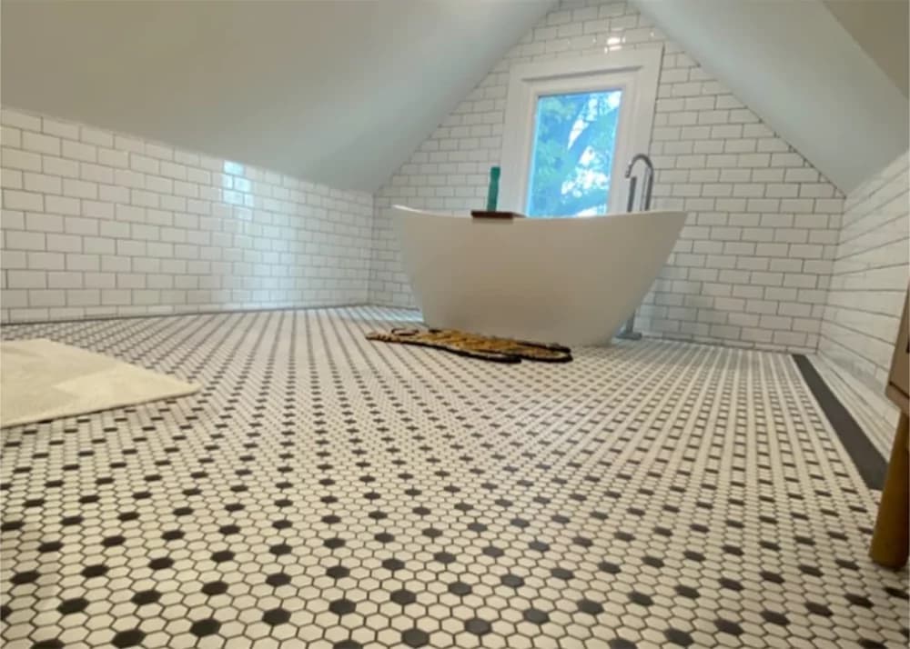 Black and white checkered porcelain floor tile installation in Clermont, FL bathroom by Aesthetic Tile
