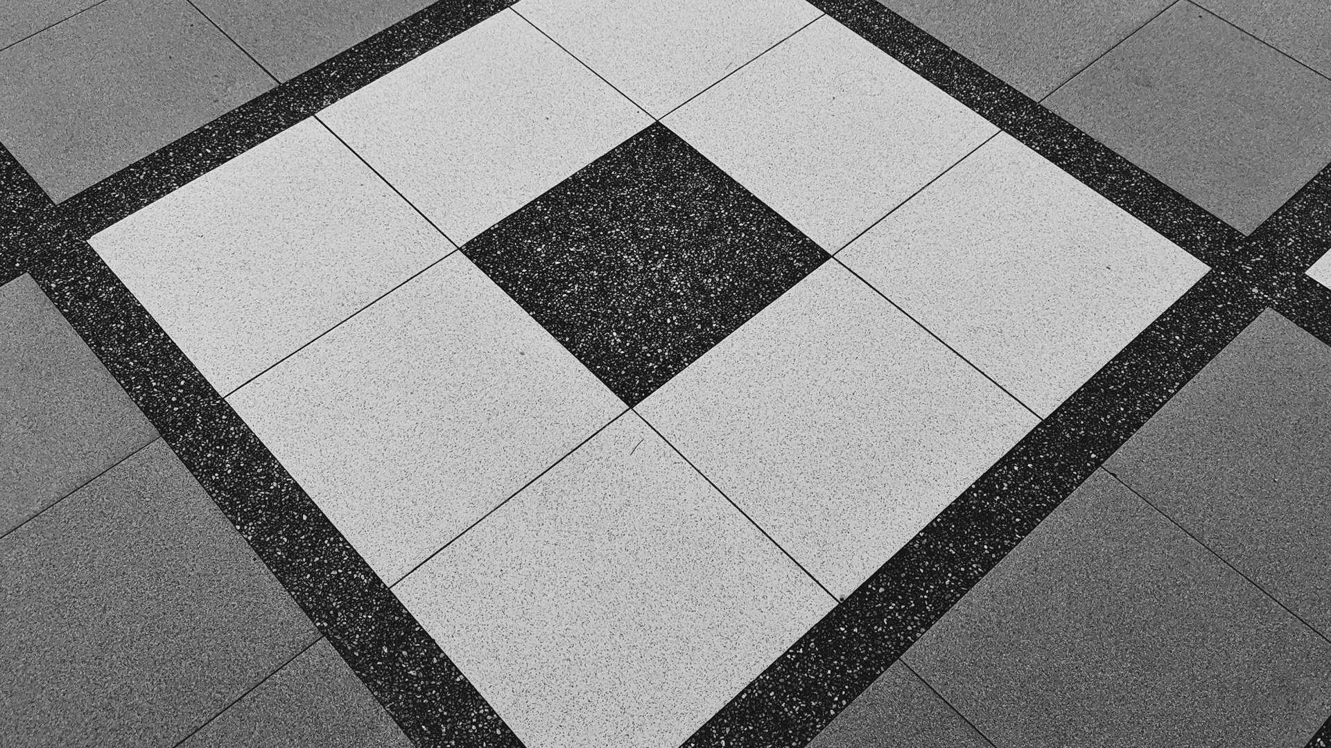 Professional tile installation showing consistent grout lines and pattern work
