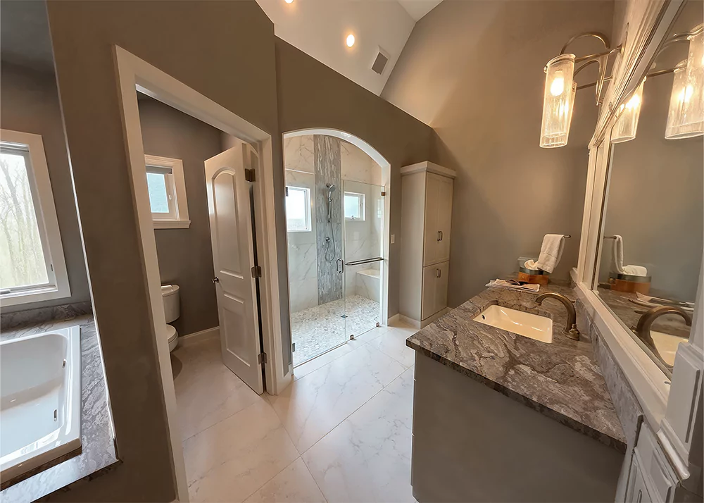 Bathroom with new tile and a brown color scheme